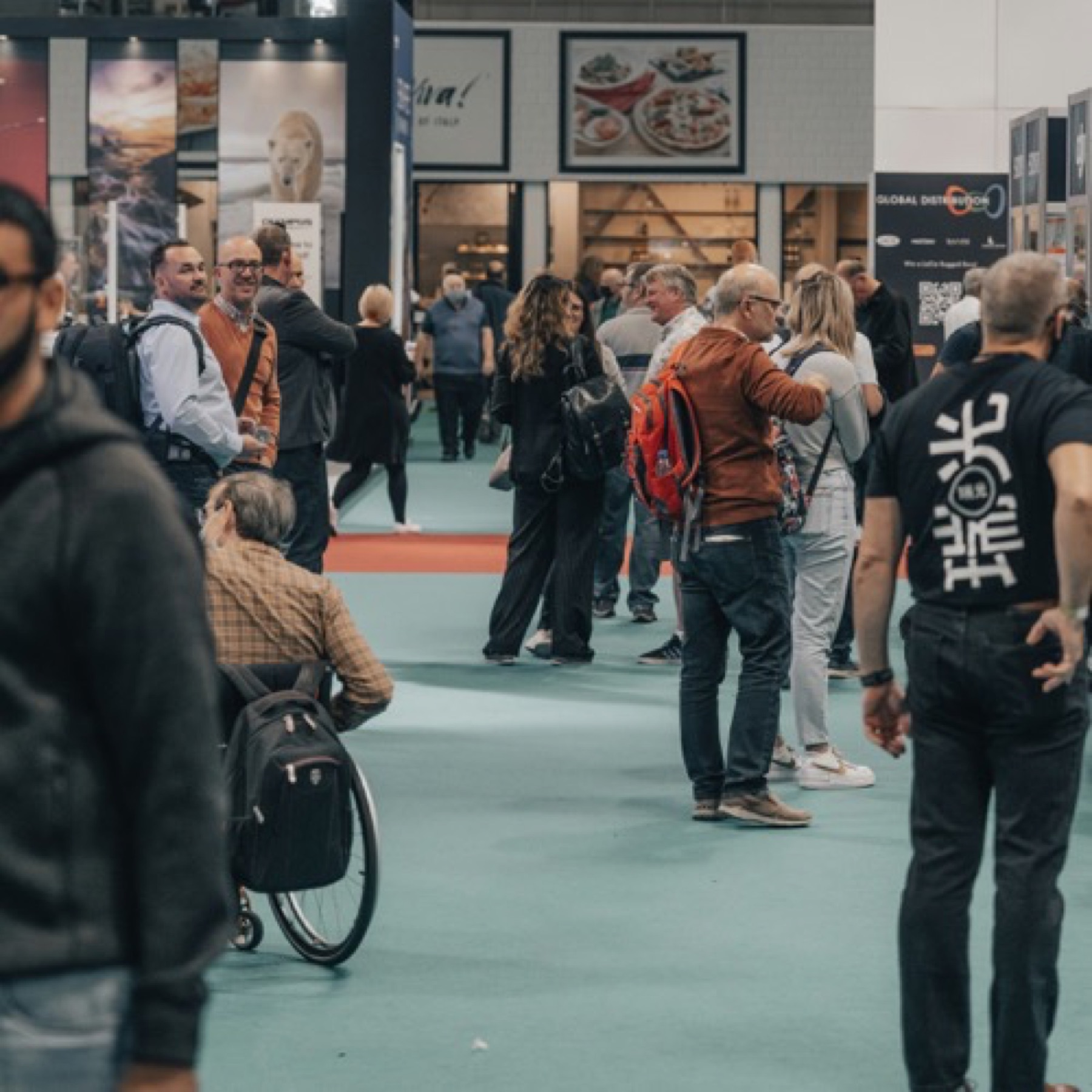 Visitors exploring a lively exhibition floor