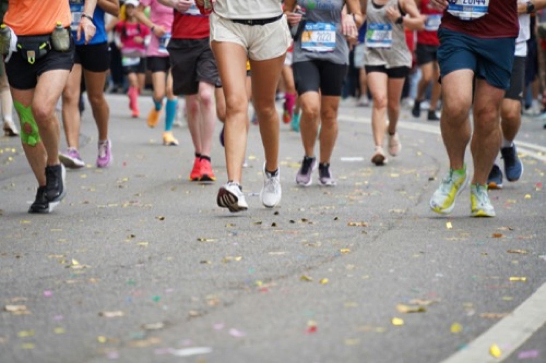 Runners moving through a vibrant road race